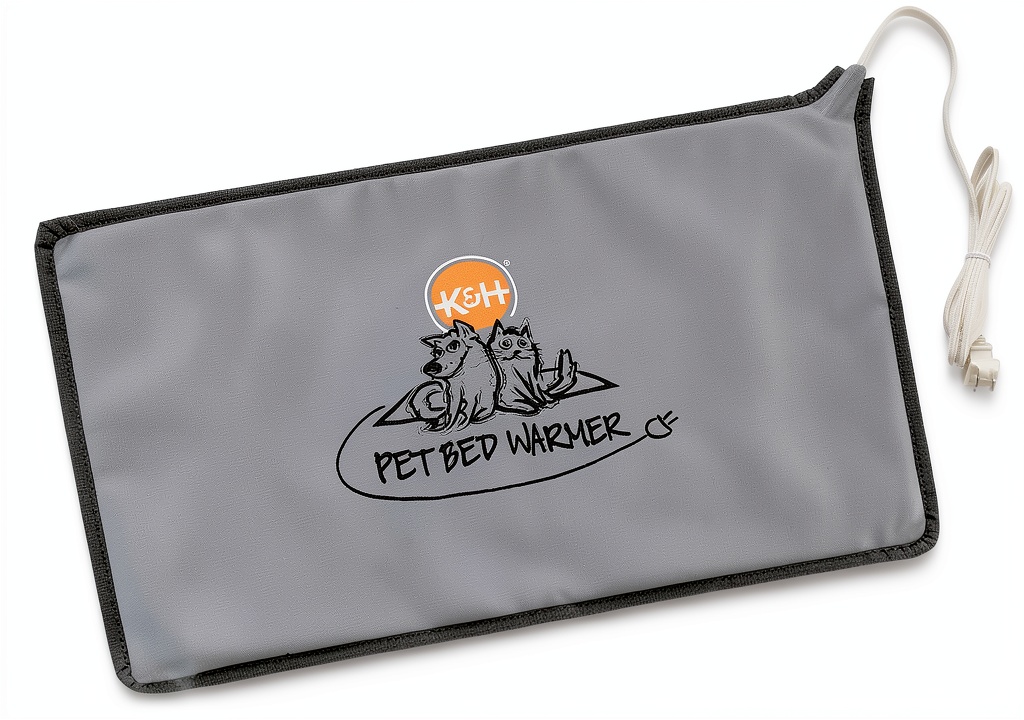 Installing K&H Pet Bed Warmer on a wooden floor with a blanket covering
